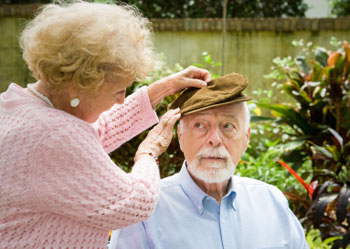 Wife looks after her elderly husband with alzheimer's disease