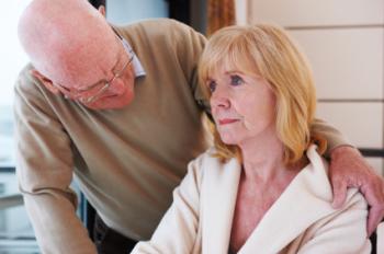 an old man comforting a confused lady