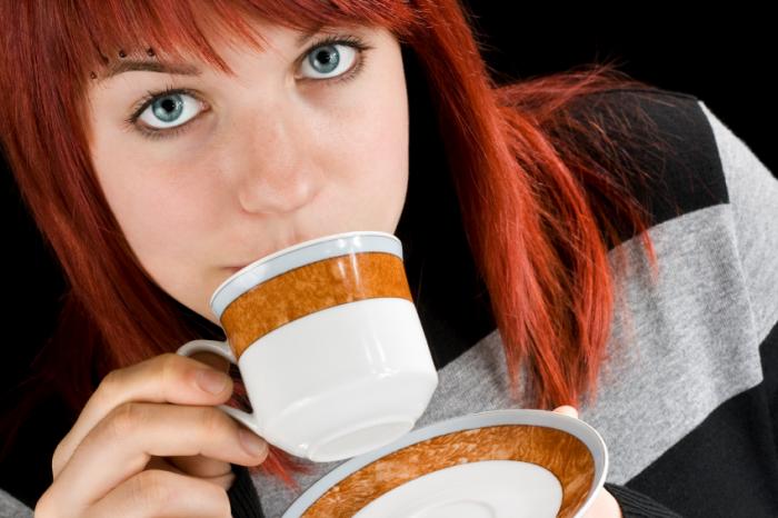 teenage girl drinking coffee