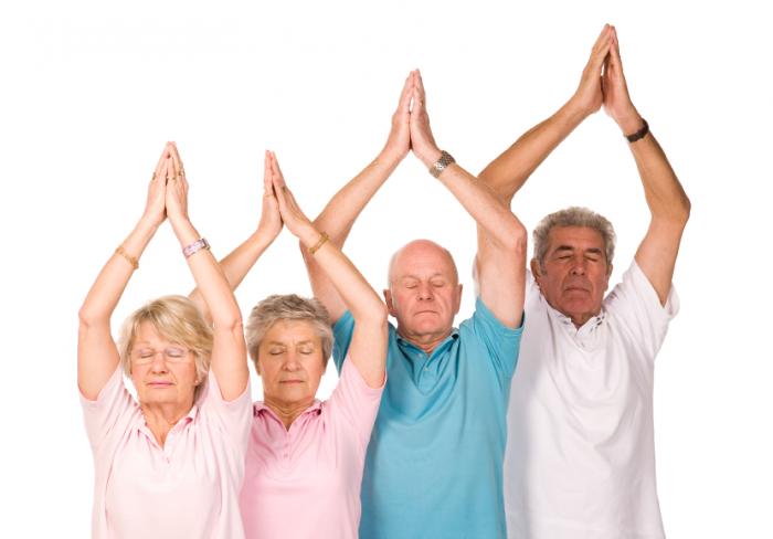 older people practicing yoga