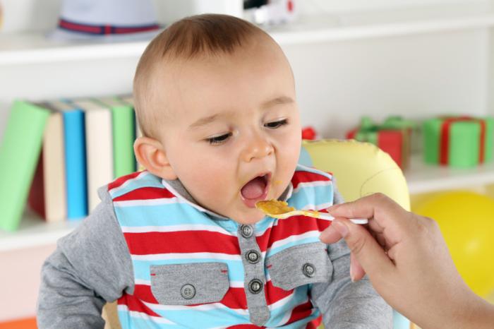 An infant being fed