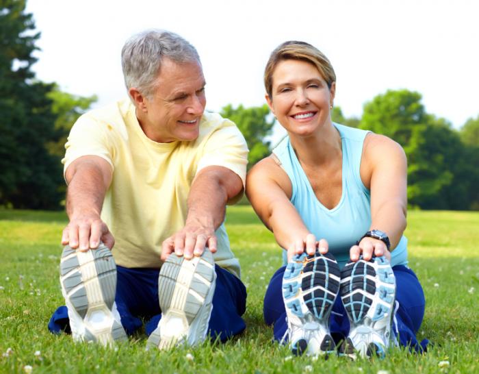 An older couple exercising together