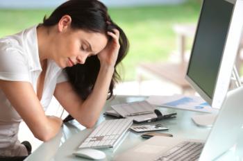 tired woman at computer